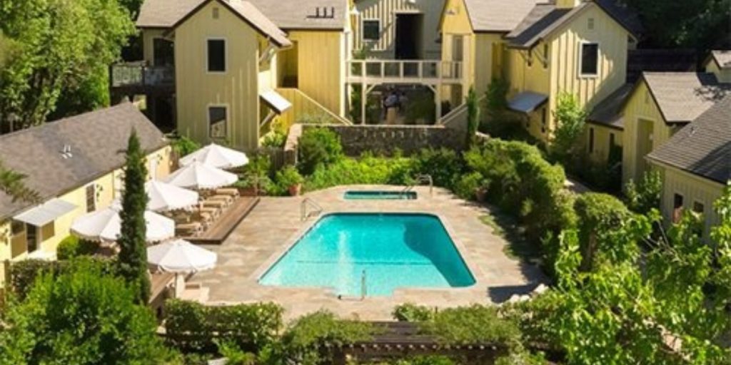 Boutique pool courtyard at a Sonoma Valley luxury hotel surrounded by gardens