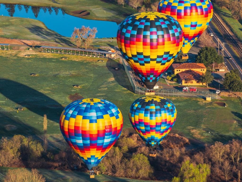 Colorful Napa Valley Aloft hot air balloons flying over wine country