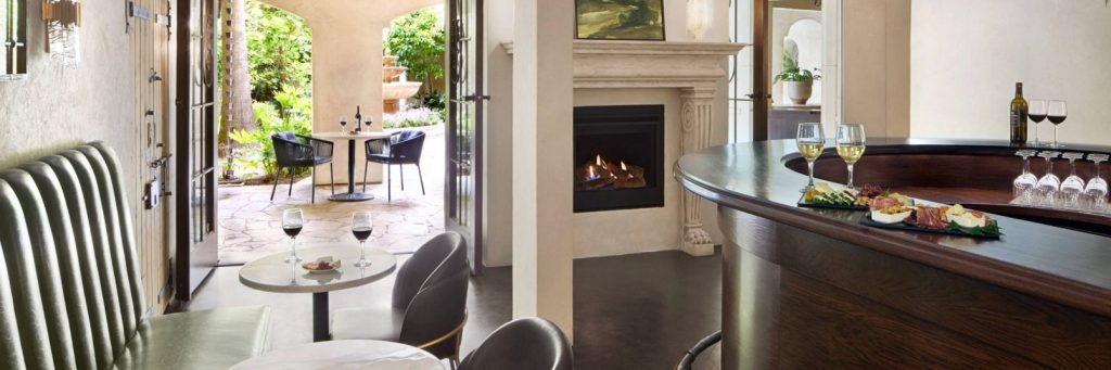 Elegant lounge with wine service and fireplace at a Sonoma Valley luxury hotel